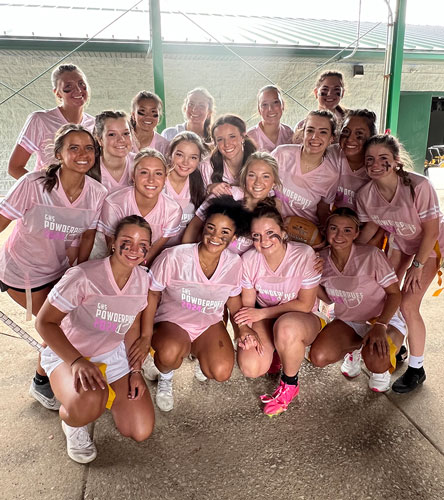 Group shot depicitng serval people wearing custom apparel