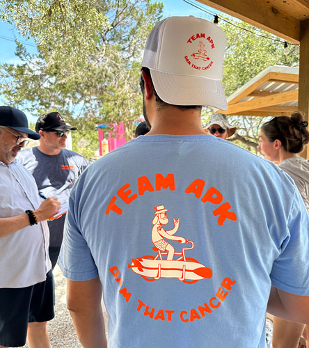 Group shot depicitng serval people wearing custom apparel