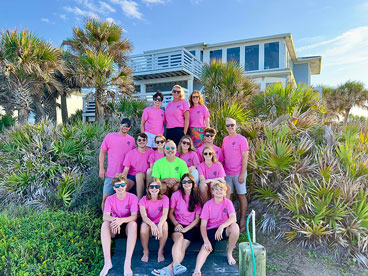 Group shot depicitng serval people wearing custom apparel